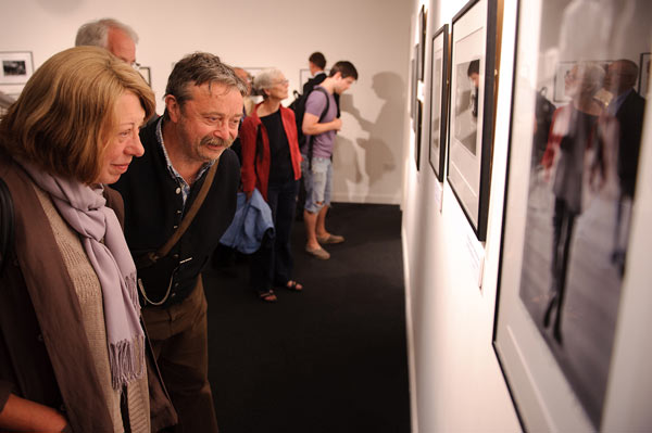 Image: Viewing the signed Minihan photographs in the exhibition
